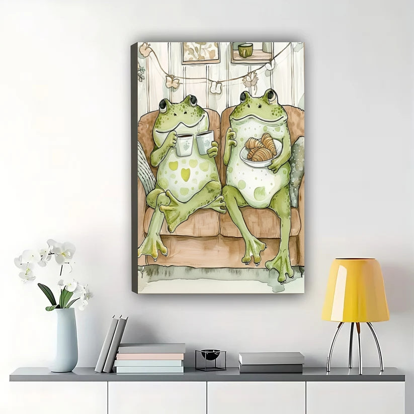 Cozy Frogs on Couch Wall Art – Whimsical Frog Couple Canvas Print with Natural Wood Frame