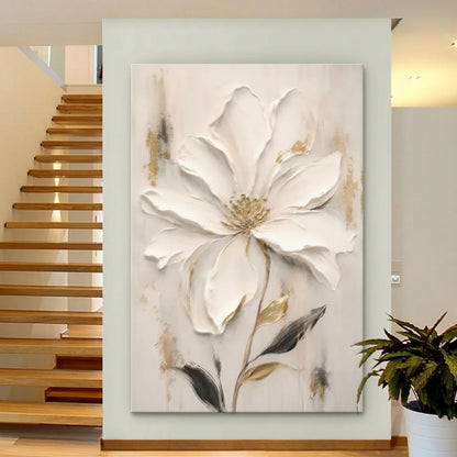 Decorative wall art of a large white flower in a modern interior setting with a staircase.