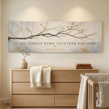 Nursery room with wooden dresser, crib, and decorative wall art with inspirational quote. All Things Work Together - Romans 8:28