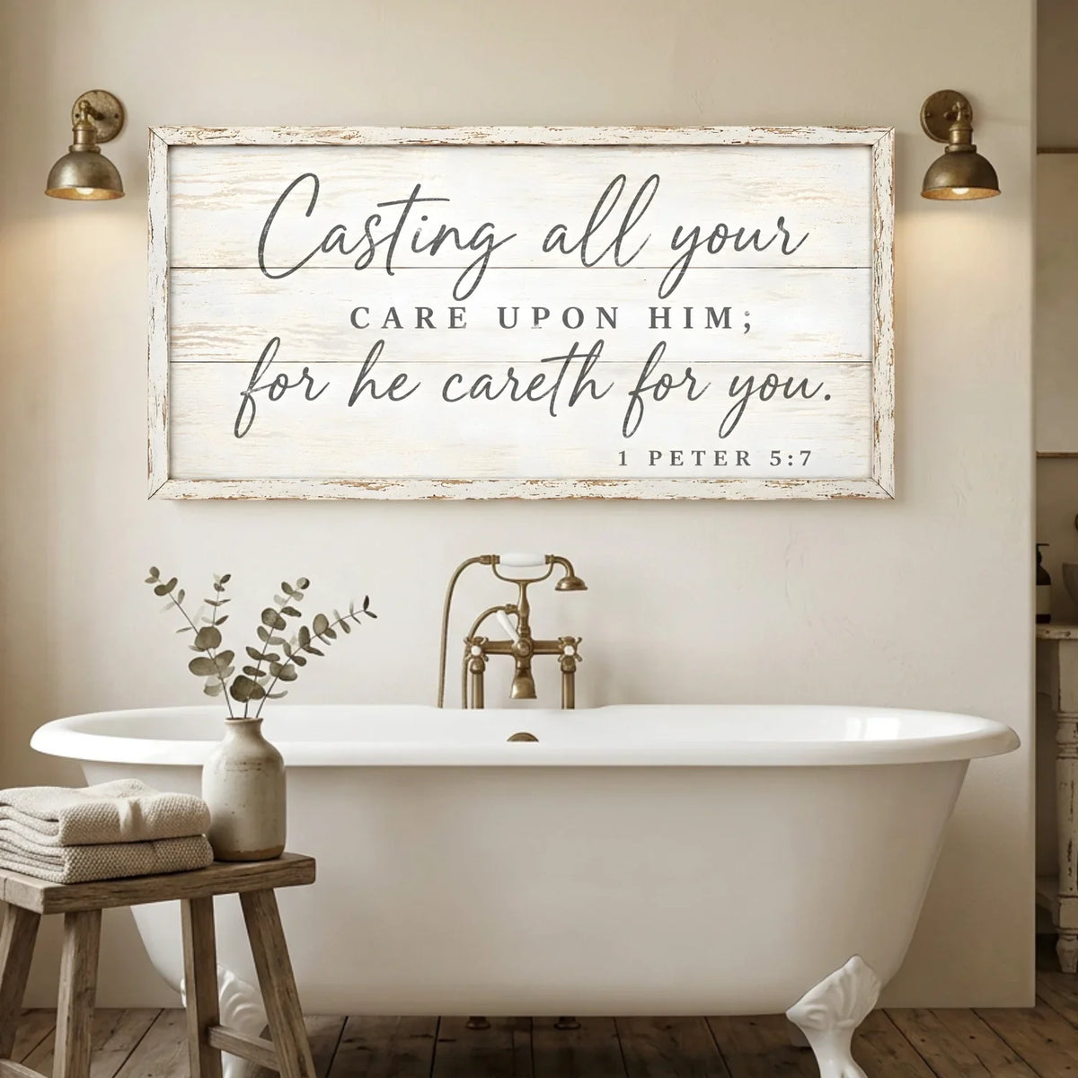 Bathroom with a freestanding bathtub, wooden stool with towels and plant, and a motivational quote sign on the wall. Casting All Your Care - 1 Peter 5:7