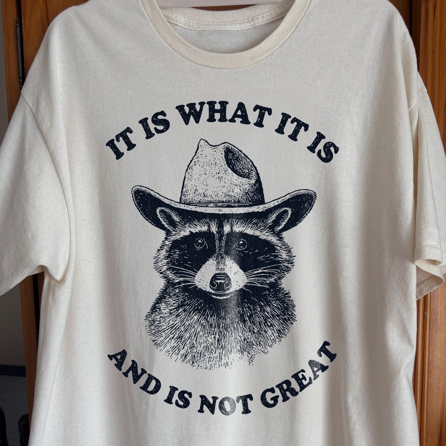 It Is What It Is (And It's Not Great) Raccoon Cowboy Shirt, funny meme tee gift (view 2)