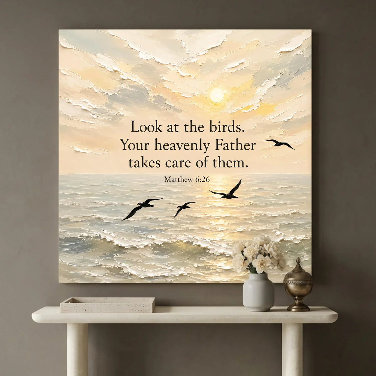 Canvas print with ocean scene and birds, featuring a motivational quote, on a wall above a console table. Look At The Birds Your Heavenly Father Takes Care Of Them - Matthew 6:26