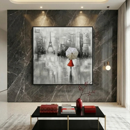 Modern living room with a large abstract painting of the Eiffel Tower on a marble wall.