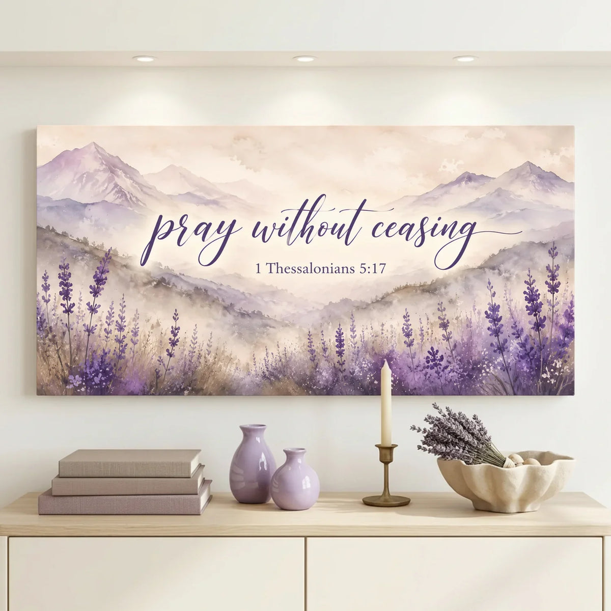 Decorative wall art with lavender and mountains on a wall above a cabinet.