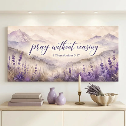Decorative wall art with lavender and mountains on a wall above a cabinet.